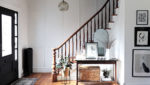 stylish foyer black and white and wood