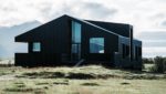 remote home with black siding