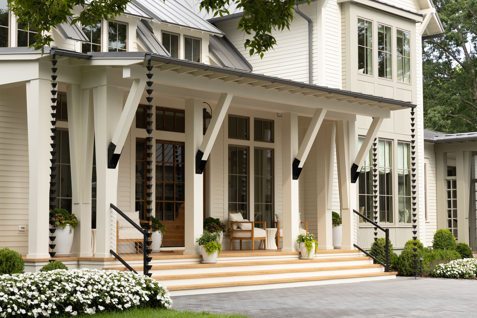 2023 Southern Living Idea House in Farmhouse Style. Beige, Cream and White home with Zuri Decking in Chestnut.